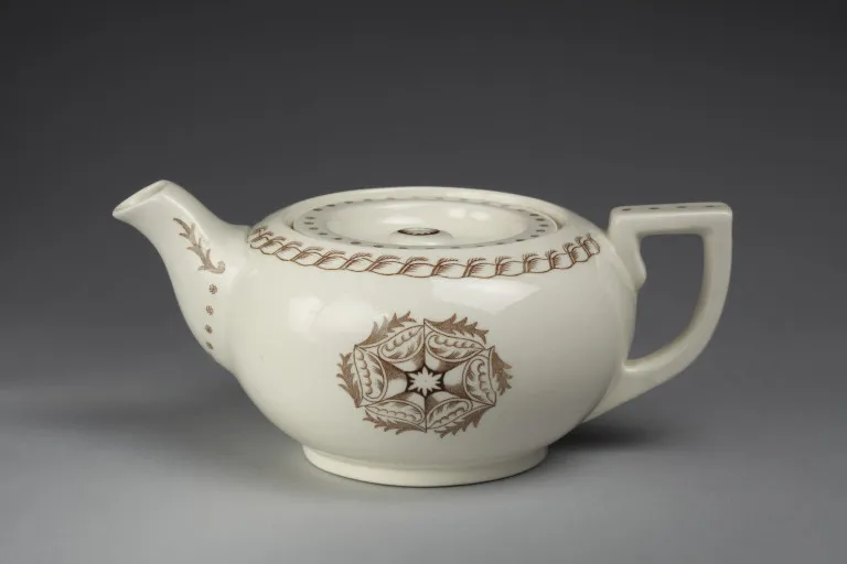 Teapot and cover - Teapot and cover of glazed earthenware.