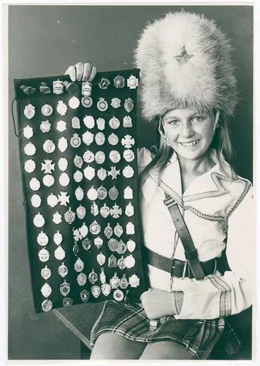 Image: Jackie Sibley, marching team leader, with medals