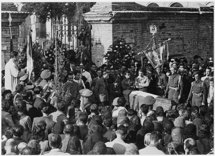 New Zealand soldiers provide a guard of honour at the funeral of two Italian partisan soldiers killed in action, Maletica