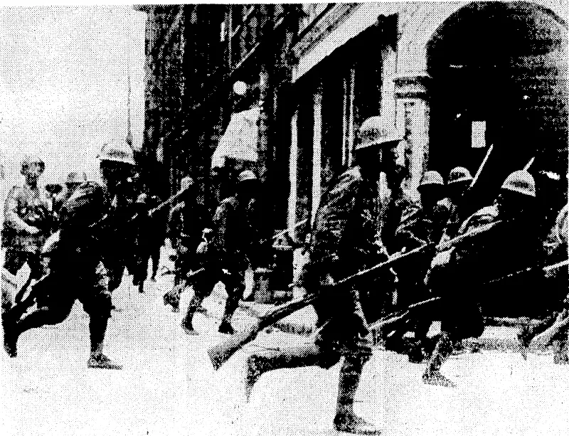 Sport and General" riioto. A Japanese landing party charging art enemy position with fixed bayonets.. This photograph was taken by a Japanese Press photographer for publication in Tokio. (Evening Post, 28 September 1937)