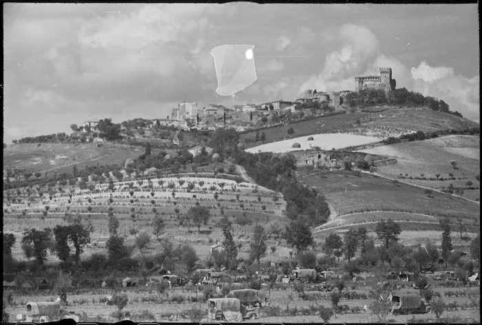 Part of New Zealand Divisional camping area below the village and castle of Gradara in Italy, World War II - Photograph taken by George Kaye