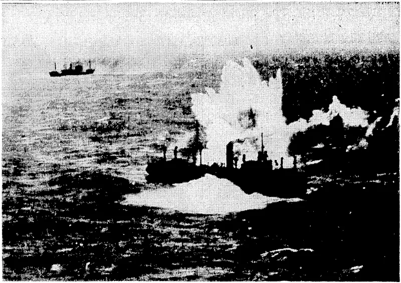Columns of water shoot up around a Japanese cargo vessel, hit by Liberators of the United States attny air force off the South China coast. The ship was left in a sinking condition. (Evening Post, 18 April 1944)
