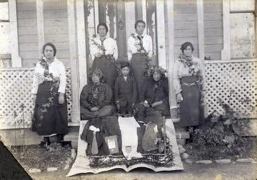 Group on a verandah : Photograph