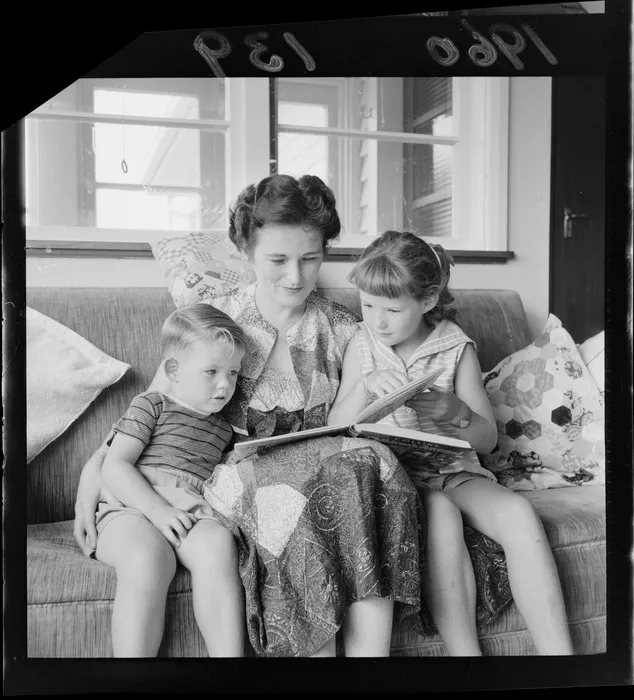 Mrs N? Mackie reading a book with her children, wife of Jockey, Mr C Mackie