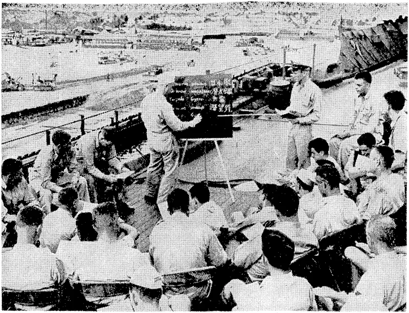 American submarine officers and men learning to speak and read Japanese in order to man submarines taken over from the enemy. (Evening Post, 25 September 1945)