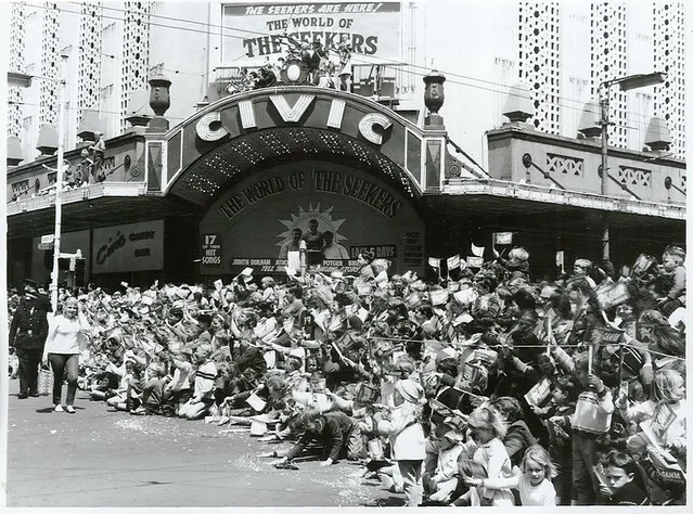 Children line the streets to see Farmers Christmas Parade in Auckland, 1968