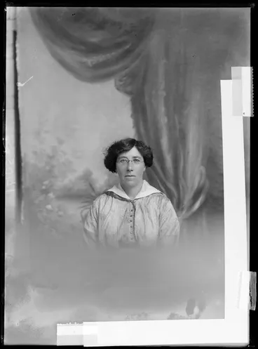 Image: Head and shoulders studio portrait of unidentified woman wearing spectacles, probably Christchurch district