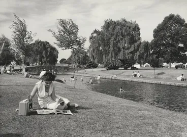 Image: Woman reading beside the creek in Windsor Park, Hastings - Photograph taken by T Ransfield