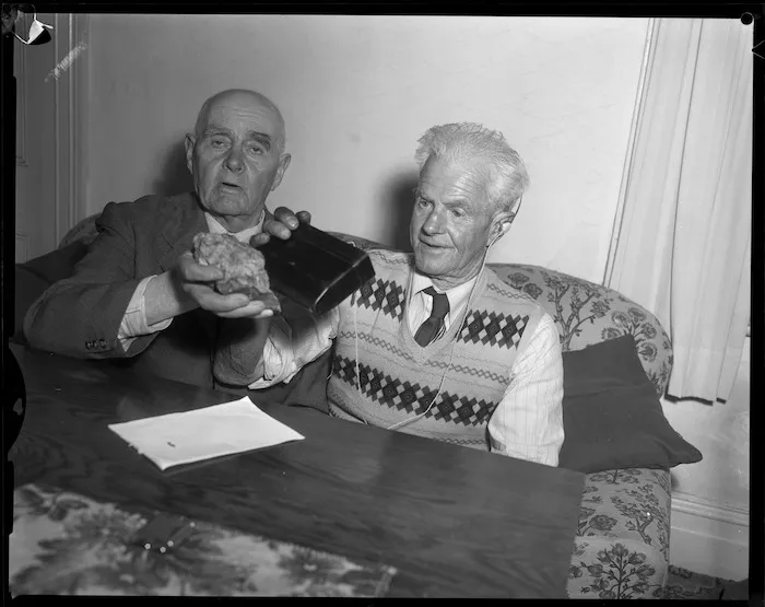 Men with uranium bearing ore