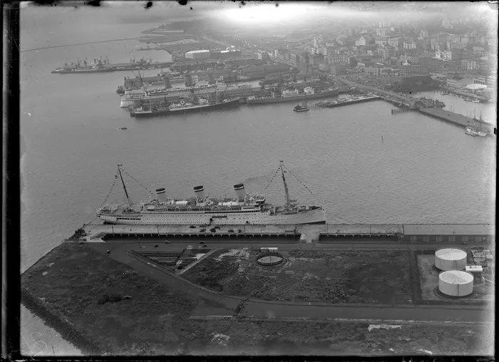 View of Freeman's Bay and the Ports of Auckland main wharves with docked ships, showing Mechanic's Bay and Auckland city central business district