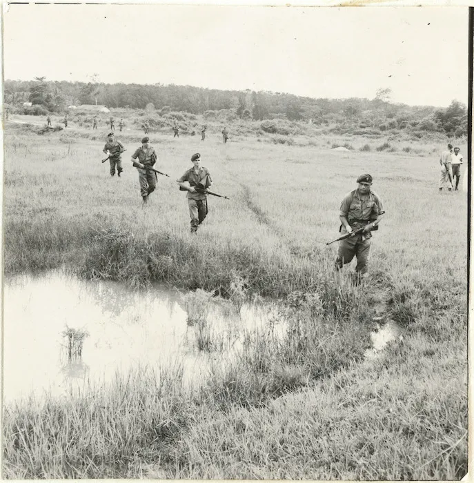 3rd flight NZ SAS, swampy ground on way to jungle training near K L, Malaya