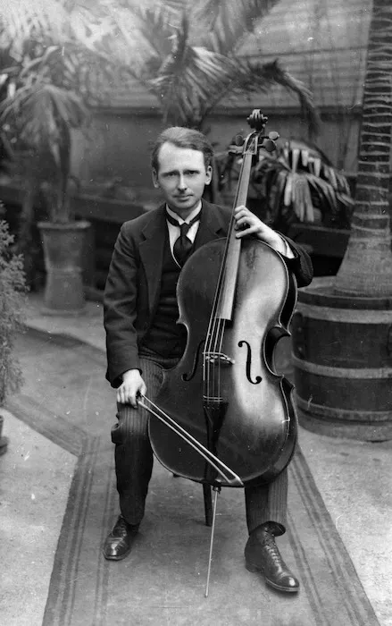 Formal seated portrait of Arnold Trowell with cello