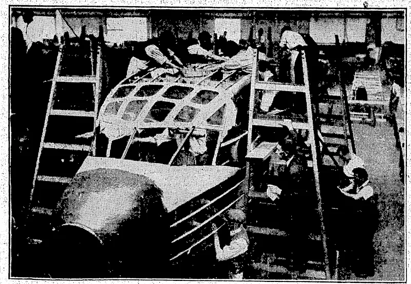 j i ' "Evening Post" Photo' JAPANESE GIFT TO, WELLINGTON GOLF.—Silver cup presented by the Japanese Good-will Mission'Jo.the Wellington' Golf Club. His >Excellency, Mr. Katsuji Debit chi, injhe presence" of Mr. J.XW. MatthewsonfActing Consul for yJapan,*presented the cuptfo Mr.tL. O* Hi Tripp, vresident of thp- rhih BUILDING AIR-LINERS FOR NEW ZEALAND.—Workmen assembling the jour engmed D H. SO ex press'air-hneis which have been ordered by Union, Airways oj New Zealand, Limited, from the Dp liavilland Aircraft Factory in England These machine!, are to be used lot the ncio 11\mJc>n vices which U]nian<-diru>ays. will operate v/Neio Zealand. (Evening Post, 31 August 1935)