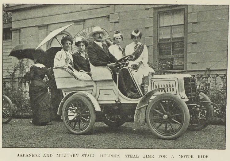 Japanese and military stall helpers steal time for a motor ride