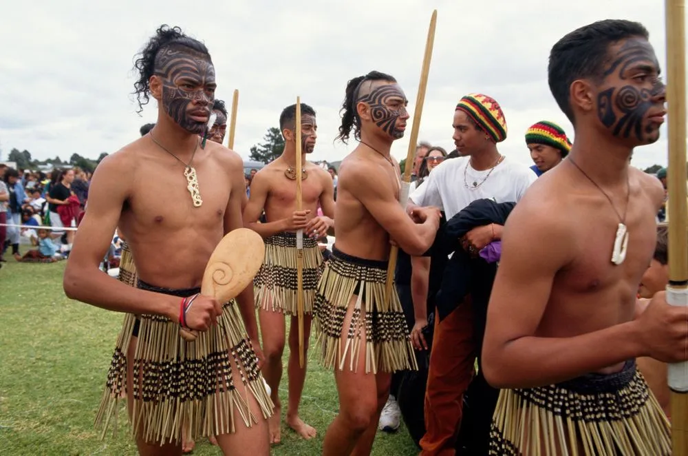 Young Maori men wearing kapa haka costumes