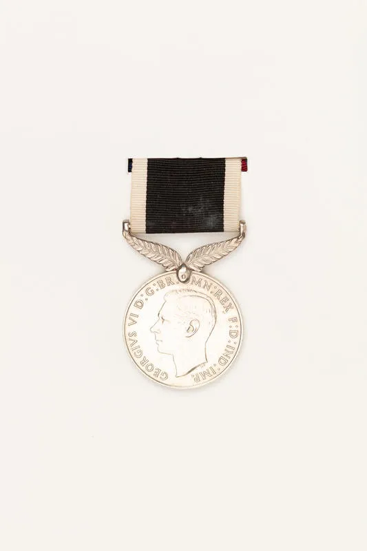 Medal: The New Zealand War Service Medal awarded to George Davis, mounted with six others