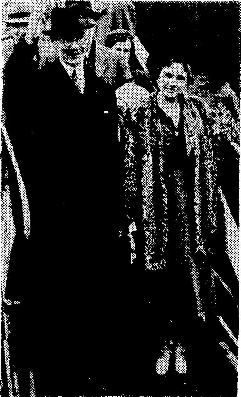 Sir Robert and Lady Craigie waving to friends as they landed from a liner which recently brought them back from Japan. Sir Robert was British Ambassador at Tokio. (Evening Post, 29 December 1942)