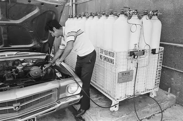 Image: Taxi driver filling his car at New Zealand's first commercial compressed natural gas filling station, Lower Hutt, Wellington