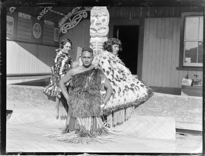 Tarihira Mihinui-Northcroft, Mihihi Kuru and Pura Konui dressed in kakahu and piupiu, at Otūkou marae, Lake Rotoaira