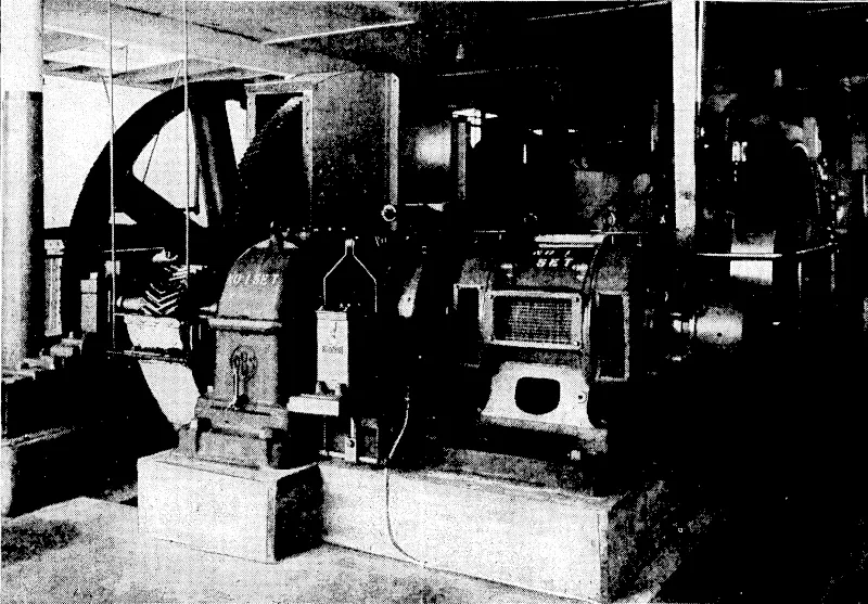 Evening Post" Photo. ELECTRIFYING THE KELBURN CABLE-TRAM.^ view, of the engine-room at the Gardens end of Upland Road, where the cables are controlled which draw the cars from LambtonQuay to the heights of Kelburri. The electric motor seen in the foreground has just been installed and will supersede the ..'■■■ steam unit, shown in the background. . ..'.:; (Evening Post, 24 July 1933)