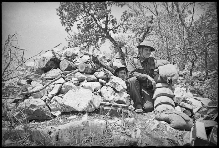 B G Smyth and R H Whittle at entrance to NZ machine gun post on 8th Army Front, Italy, World War II - Photograph taken by George Kaye