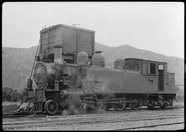 Image: Steam locomotive beside a water tower