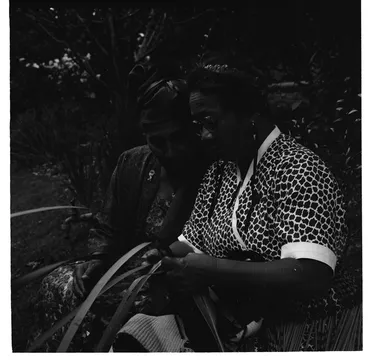 Image: Women weaving with flax at a Maori Women's Welfare League fund raising garden party for the Maori Education Foundation