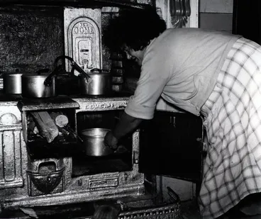 Image: She has made dough of flour and lemon-water and puts it in the warm oven to rise