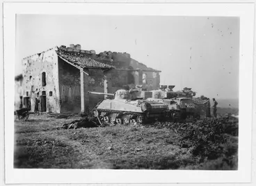 Image: Tanks by a building in the Massa Lombarda area , Italy, during World War II - Photograph taken by W K Lloyd