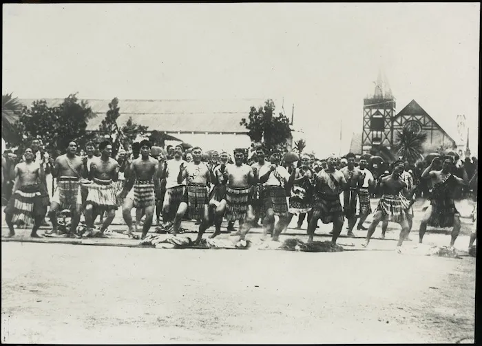 Men performing a haka at Ohinemutu during the visit of the Prince of Wales