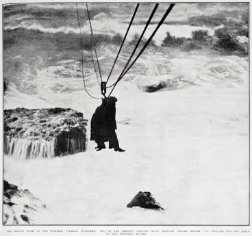 Image: The rescue work on the wrecked steamer Wiltshire: two of the vessel's company being brought ashore before the life-line was got clear of the seething waters