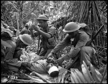 Image: Attending to a wounded World War II soldier, Pacific region