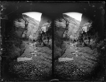 Image: Rocky cliffs and T W Brebner on horse, near Cape Kidnappers