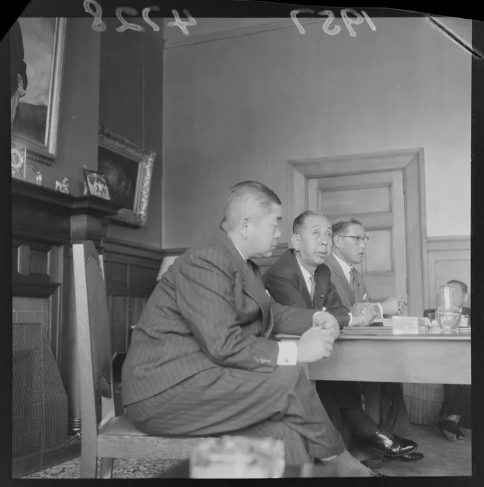 The Prime Minister of Japan, Mr Nobusuke Kishi, with officials