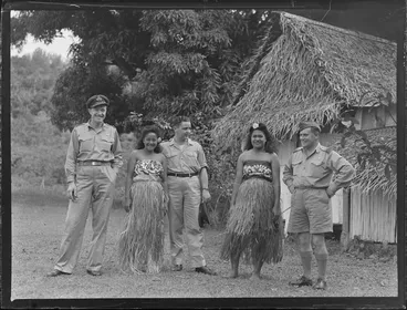 Image: Unidentified RNZAF men with two unidentified local girls in island costume, Rarotonga, Cook Islands