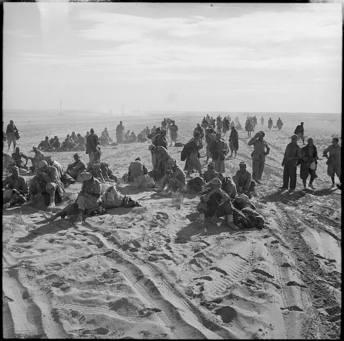 Axis prisoners on the roadside during pursuit from Alamein, Egypt - Photograph taken by H Paton