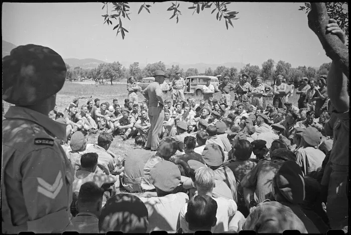 Prime Minister Peter Fraser talks with 2 Divisional Workshops personnel in the Volturno area, Italy, World War II - Photograph taken by George Bull