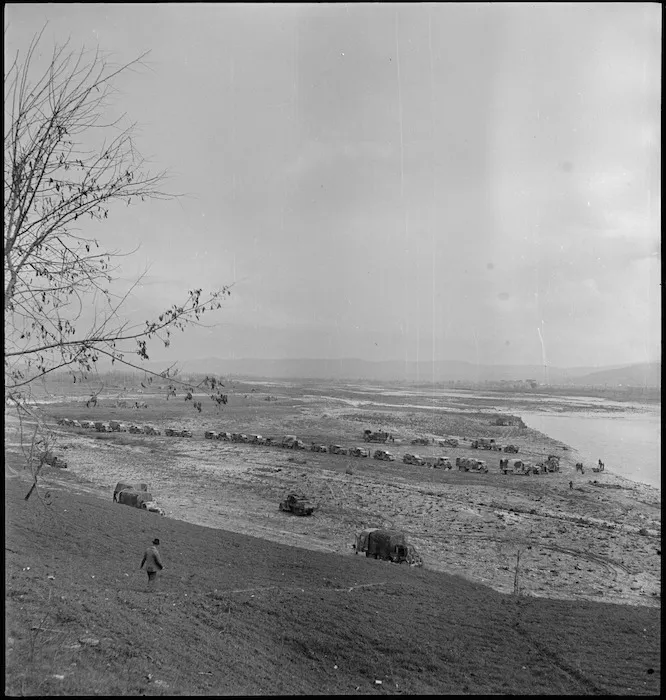NZ Division water carts lined up on the banks of the Sangro River in Italy, World War II - Photograph taken by George Kaye