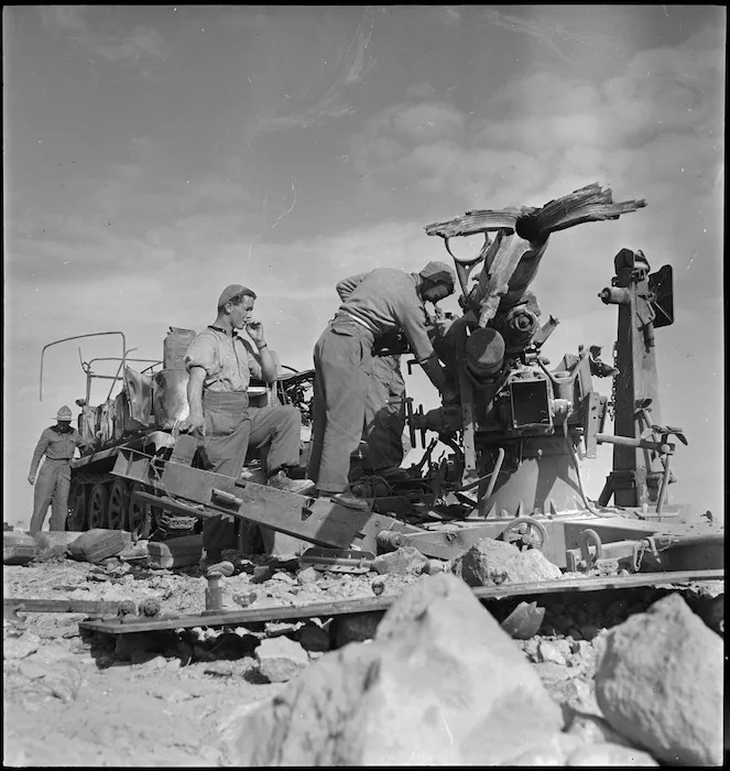 New Zealanders survey wreckage near Beni Ulid, Libya - Photograph taken by H Paton