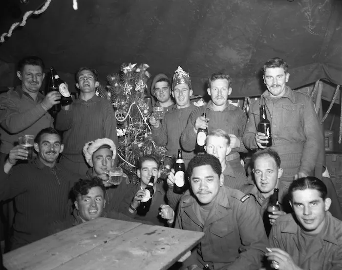 Kiwis at 10 Coy RNZASC gather around their Xmas tree at Coy HQ