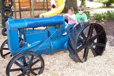 Image: Children on the tractor in Queen Elizabeth Park playground