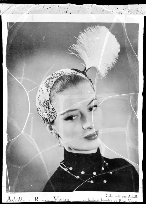 Model wearing feather headpiece