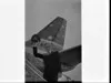 Unidentified doctor on the steps of Air New Zealand DC-8 jet, Mascot