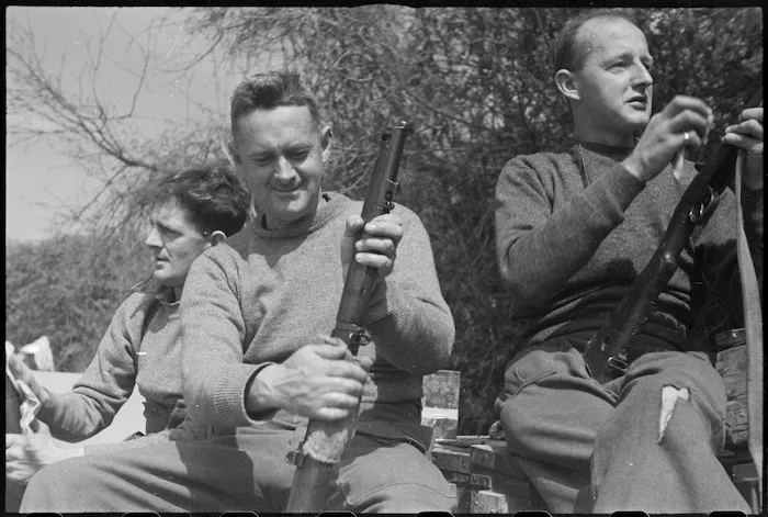 NZ frontline infantrymen cleaning rifles behind the lines on the Cassino Front, Italy, World War II - Photograph taken by George Kaye
