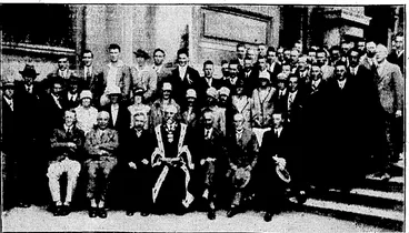 Image: i • ' ".Evening I'ost" Photo. Civic reception yesterday afternoon tendered, by the Mayor (Mr. G. A. Troup) to visiting athletes taking part in the New Zealand-championships. Seated in the front row, from left to right; Mr. A. L. Lewis (manager of the Cantorbury team), Mr. E. L. Macassey (president of the Otago Centre, N.Z.A.A.A., and manaoer of the Otago team); the Hon.'W. A. Veltch (Minister of Labour), tho Mayor (Mr. G. A. Troup), Mr. H Austad (member of council, N.Z.A.A.A.), Councillor W. H. Bonnctt, Mr. A. C. Kitto (president of tho Wellington Centre, "N.Z.A.A.A.). (Evening Post, 23 February 1929)