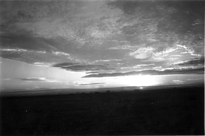 Sunset, Libya, World War II New Zealand troops silhouetted in the distance