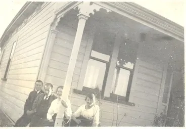 Image: 2 men and 2 women on verandah of a villa c1906.