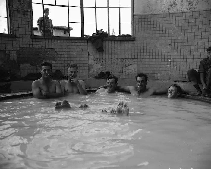 Drivers H R Kelly, K W Hamblyn, S P Parkinson, W T Capper and B C Marychurch in a hot mineral bath at a staging area on 10 Company's trip to Pusan