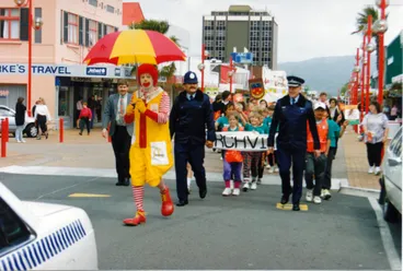 Image: School crossing children's parade 1993 in Main Street, with 'Ronald McDonald'.