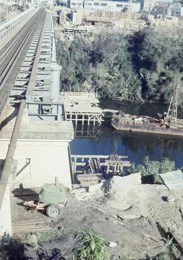 Image: Construction of the State Advances Corporation building and the new railway bridge begins